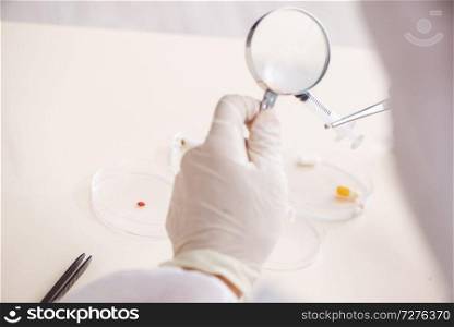 Young expert criminologist working in the lab 