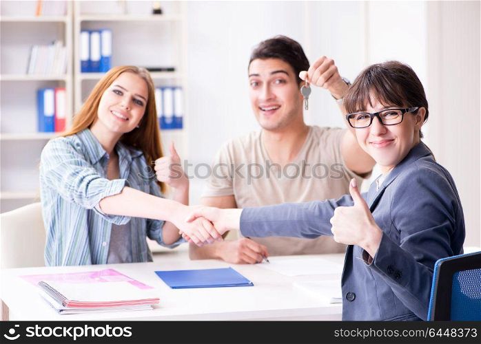 Young family agreeing mortgage contract in the bank for new house. Young family agreeing mortgage contract in the bank for new hous