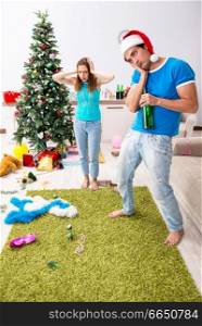 Young family celebrating christmas at home