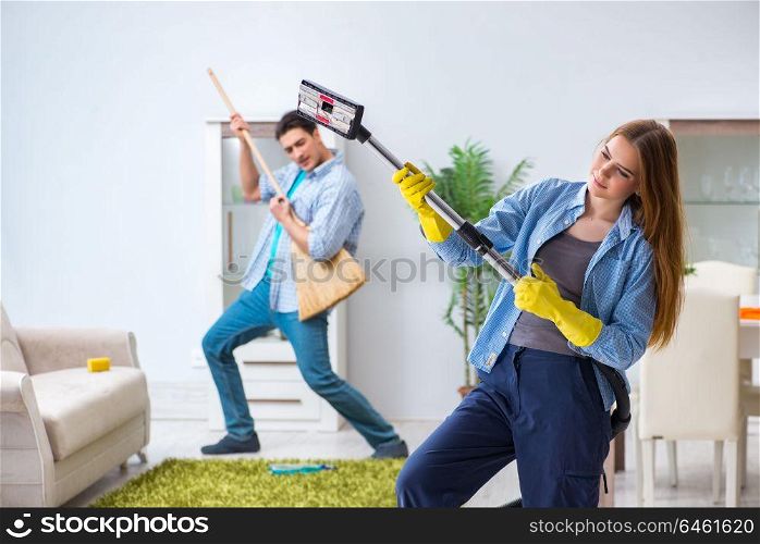 Young family cleaning the house