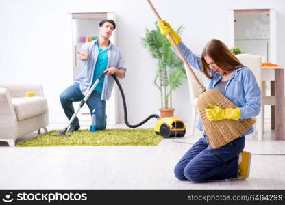 Young family cleaning the house