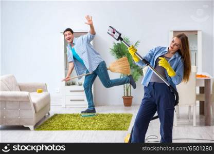 Young family cleaning the house