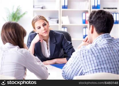 Young family filing divorce papers with lawyer