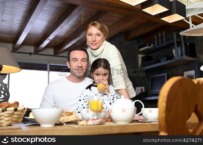 Young family having breakfast