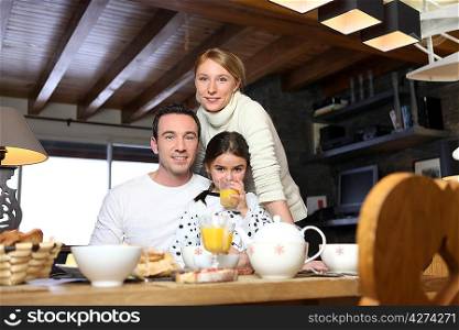 Young family having breakfast