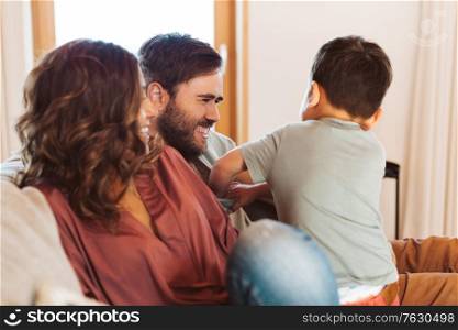 Young family having fun at home