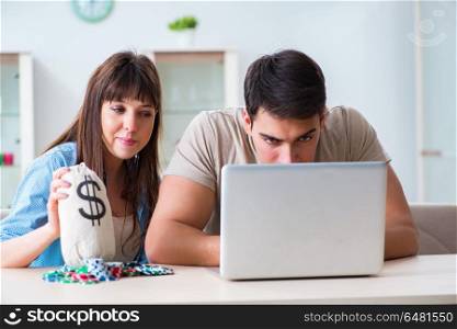 Young family losing money in online casino