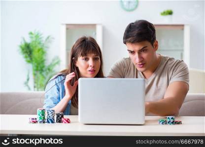 Young family losing money in online casino