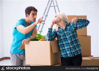 Young family moving in to new apartment