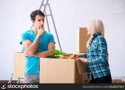 Young family moving in to new apartment