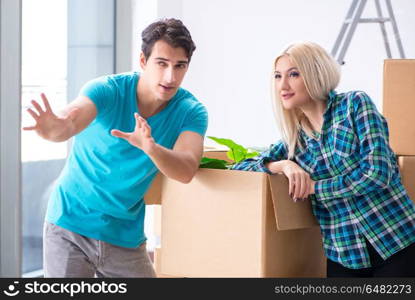 Young family moving in to new apartment