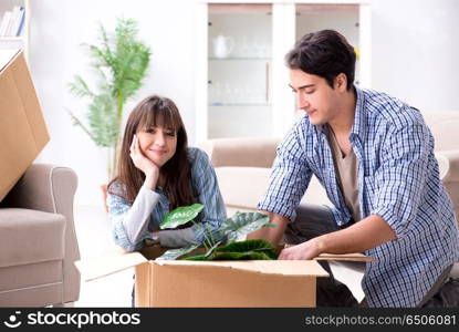 Young family moving in to new apartment after paying off mortgag. Young family moving in to new apartment after paying off mortgage. Young family moving in to new apartment after paying off mortgag