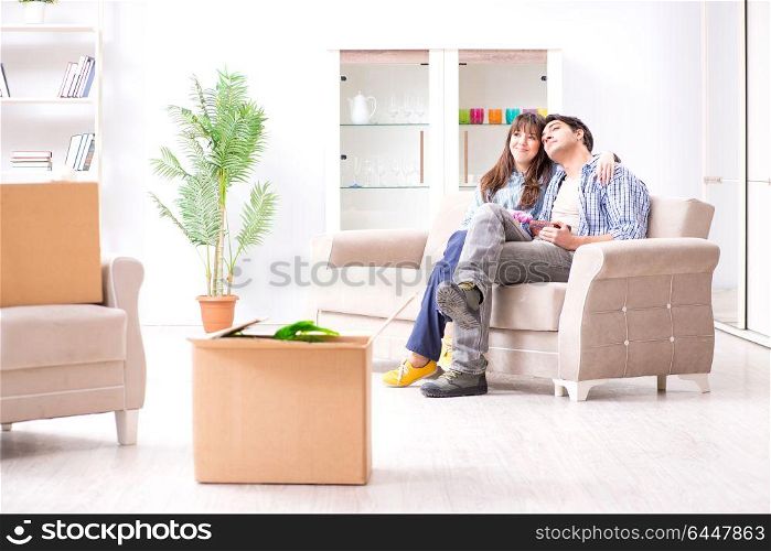Young family moving in to new apartment after paying off mortgage. Young family moving in to new apartment after paying off mortgag
