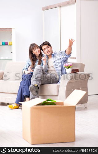 Young family moving in to new apartment after paying off mortgage. Young family moving in to new apartment after paying off mortgag