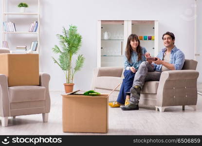 Young family moving in to new apartment after paying off mortgage