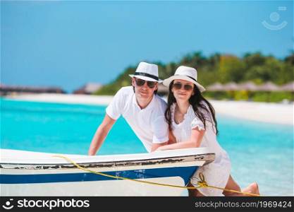 Young family of two on white beach enjoy vacation. Young couple on white beach during summer vacation.