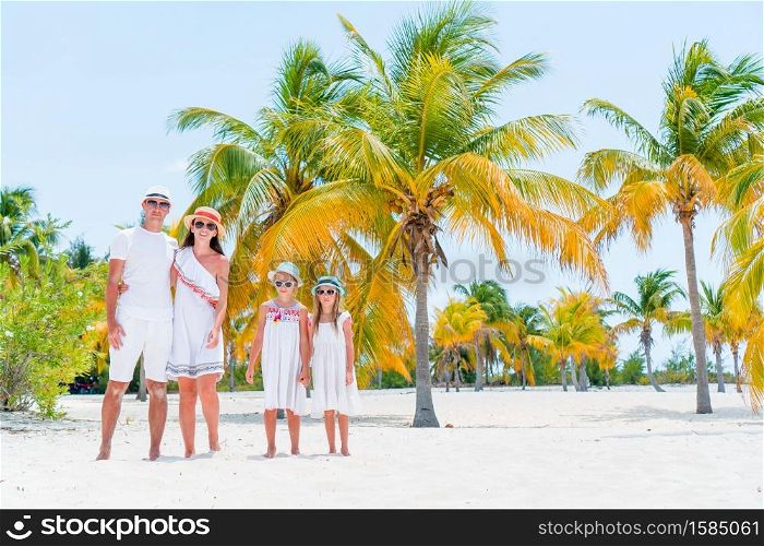Young family on beach vacation have a lot of fun together. Young family on vacation on the beach