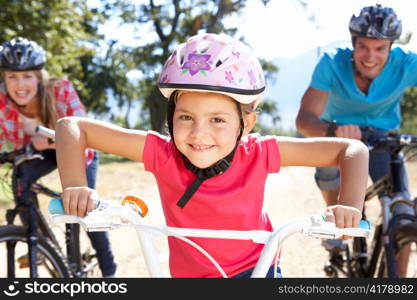 Young family on country bike ride