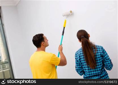 Young family painting the walls in DIY concept
