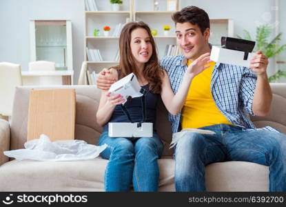 Young family playing games with virtual reality glasses