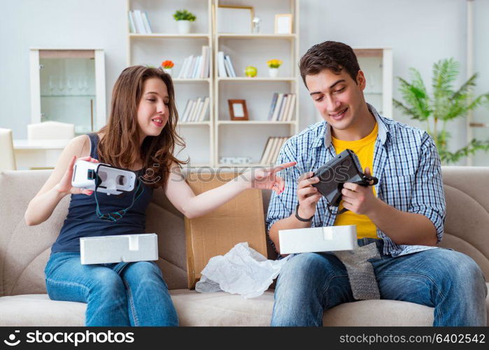 Young family playing games with virtual reality glasses