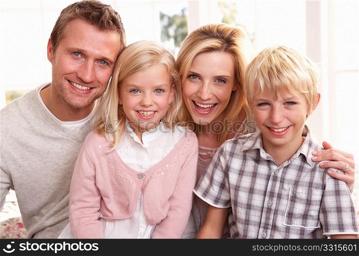 Young family pose together
