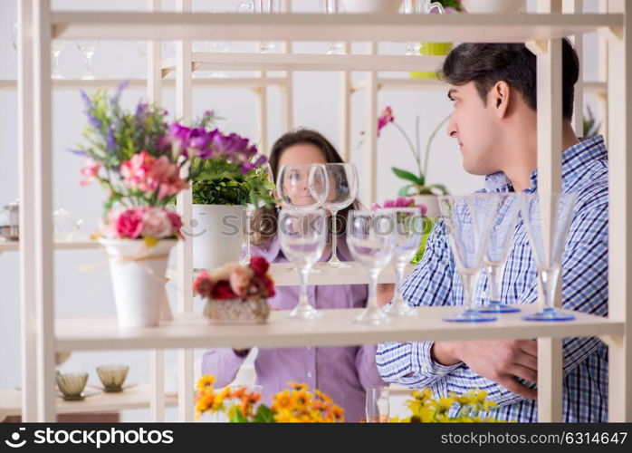 Young family shopping in shop