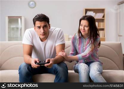 Young family suffering from computer games addiction
