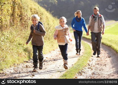 Young family walking in park