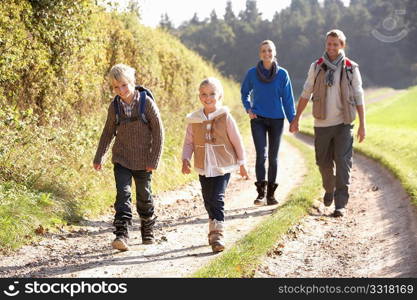 Young family walking in park