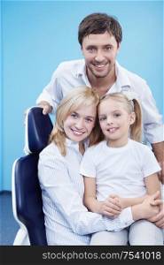 Young family with a child in dentistry