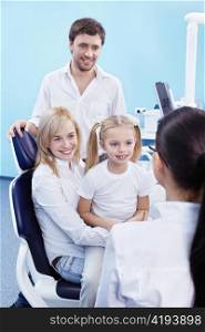 Young family with a child in the dental office