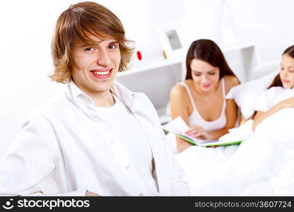 Young family with little daughter at home together