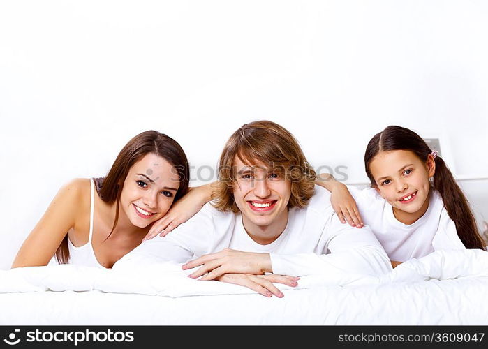 Young family with little daughter at home together