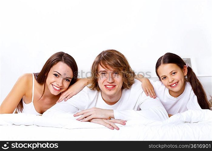 Young family with little daughter at home together