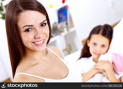 Young family with little daughter at home together