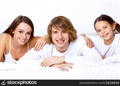 Young family with little daughter at home together