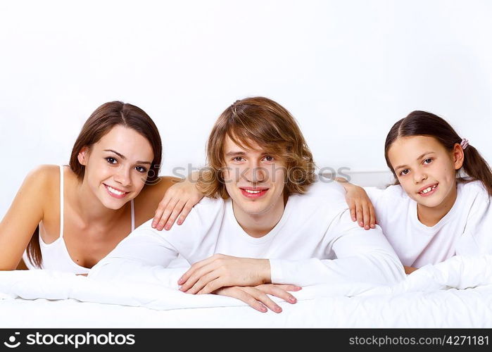 Young family with little daughter at home together