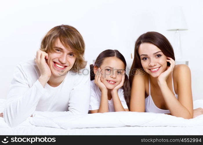 Young family with little daughter at home together