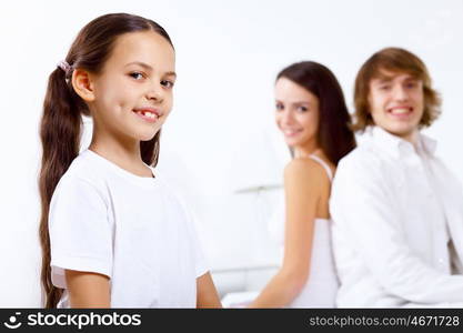 Young family with little daughter at home together