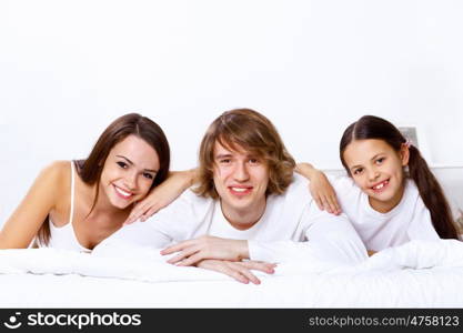 Young family with little daughter at home together