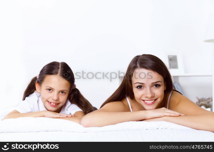 Young family with little daughter at home together