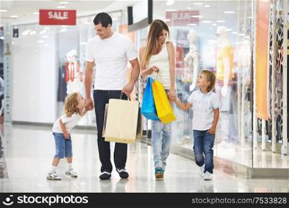 Young family with two children in the store