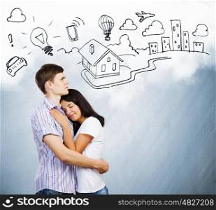Young family. Young couple hugging each other and dreaming about future