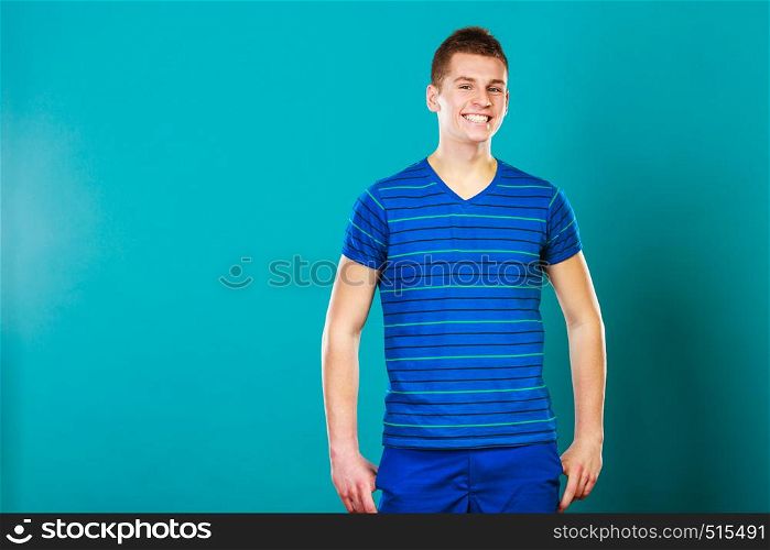 Young fashionable man casual style positive face expression posing on blue