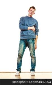 Young fashionable man teen boy in full length casual style blue jeans posing isolated on white
