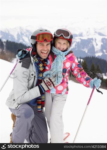 Young Father And Daughter On Ski Vacation