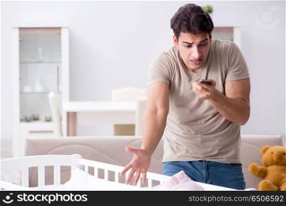 Young father dad frustrated at crying baby
