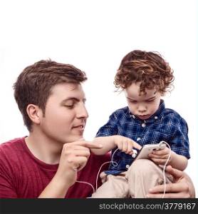 Young father teach his son to work with smartphone