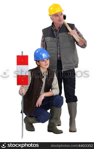 young female apprentice and senior carpenter